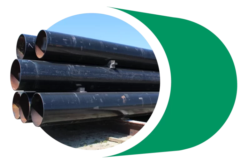 Large diameter pipes sit in storage.