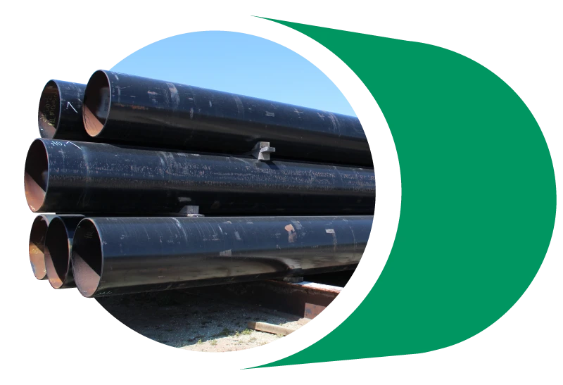 Large diameter pipes sit in storage.